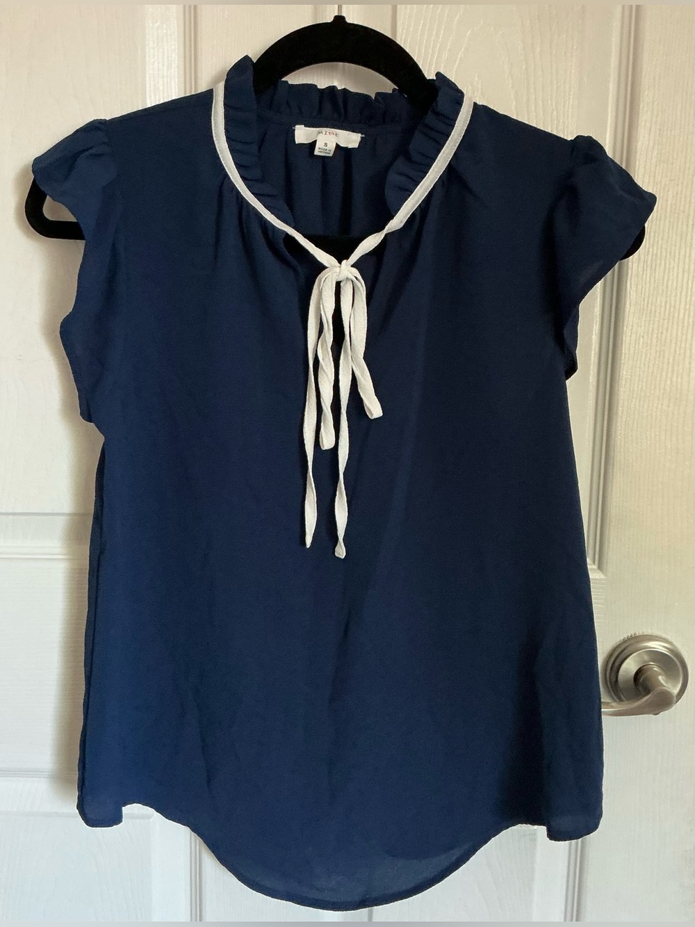 Sleeveless navy blouse